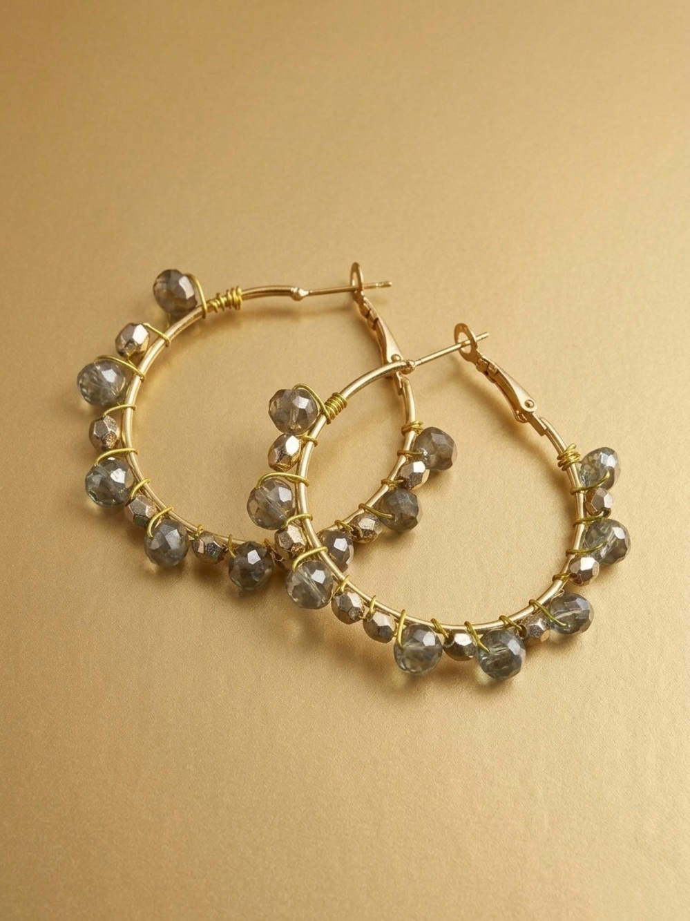 Hand sewn Gold Hoop Earrings with Gray Faceted Beads